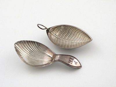 Appraisal: Two Sheffield-made caddy spoons one with a fluted bowl and