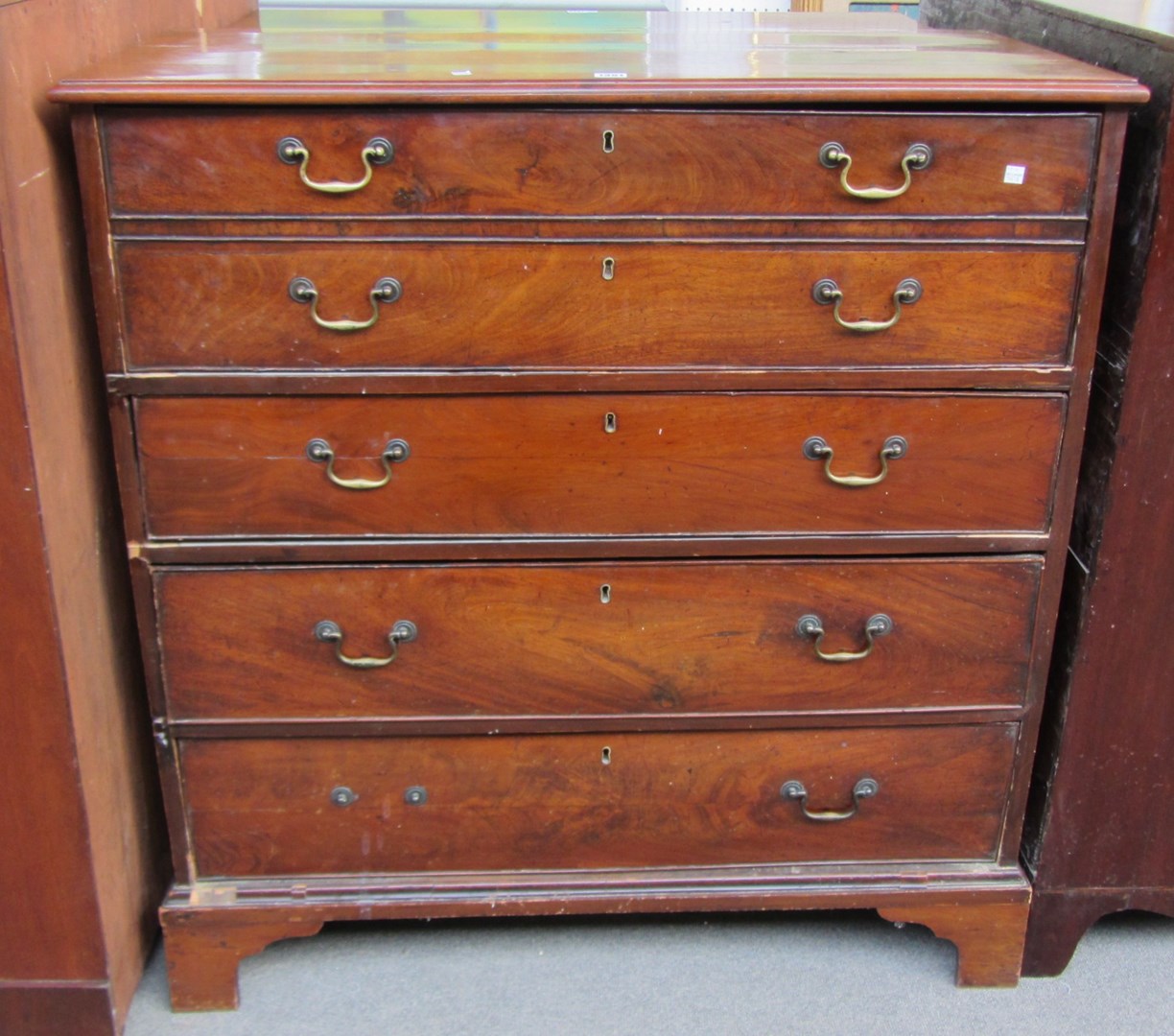 Appraisal: A George III mahogany straight front chest with five graduated