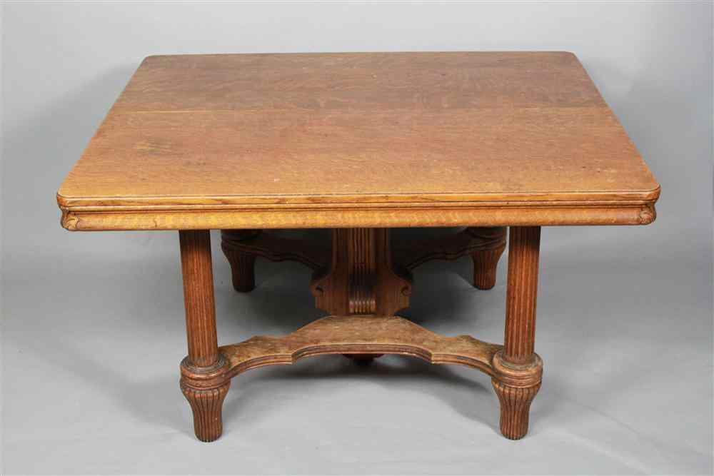 Appraisal: AMERICAN OAK DINING TABLE WITH TWO LEAVES with rounded rectangular