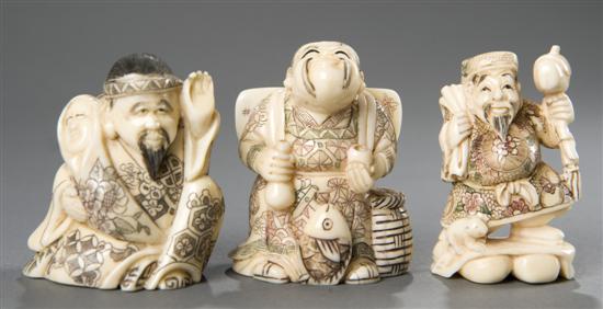 Appraisal: Group of Japanese ivory figural netsukes Early th century Man