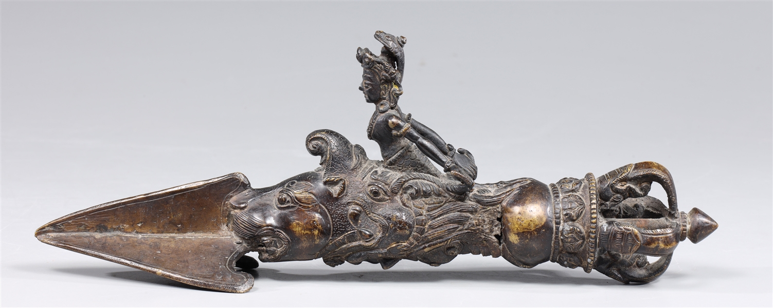 Appraisal: Bronze Tibetan ritual Phurba depicting Ganga riding on her pack