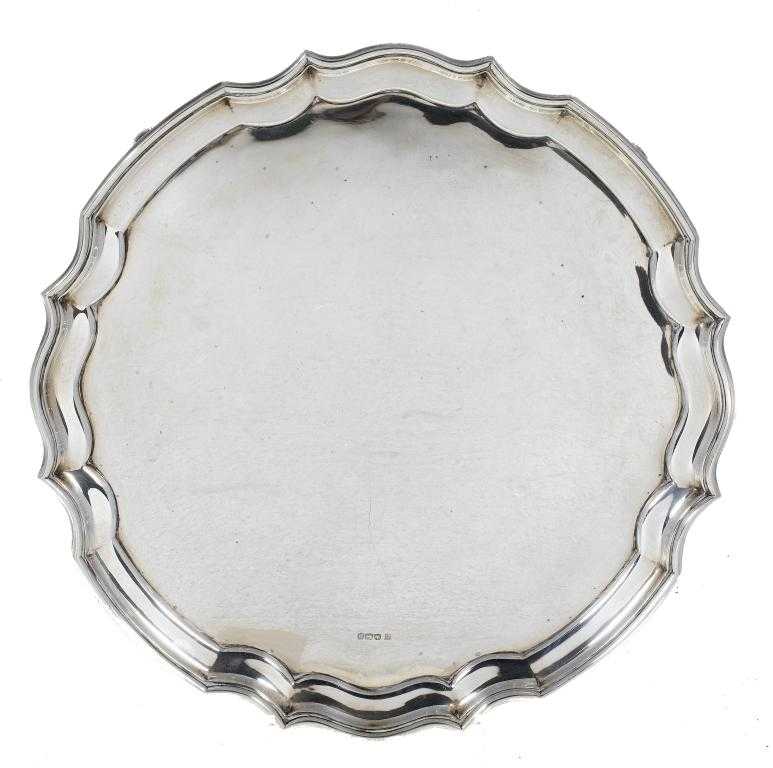 Appraisal: A GEORGE V SALVER the plain field in moulded rim