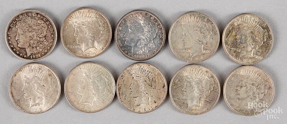 Appraisal: Ten silver dollars Ten silver dollars to include eight Peace