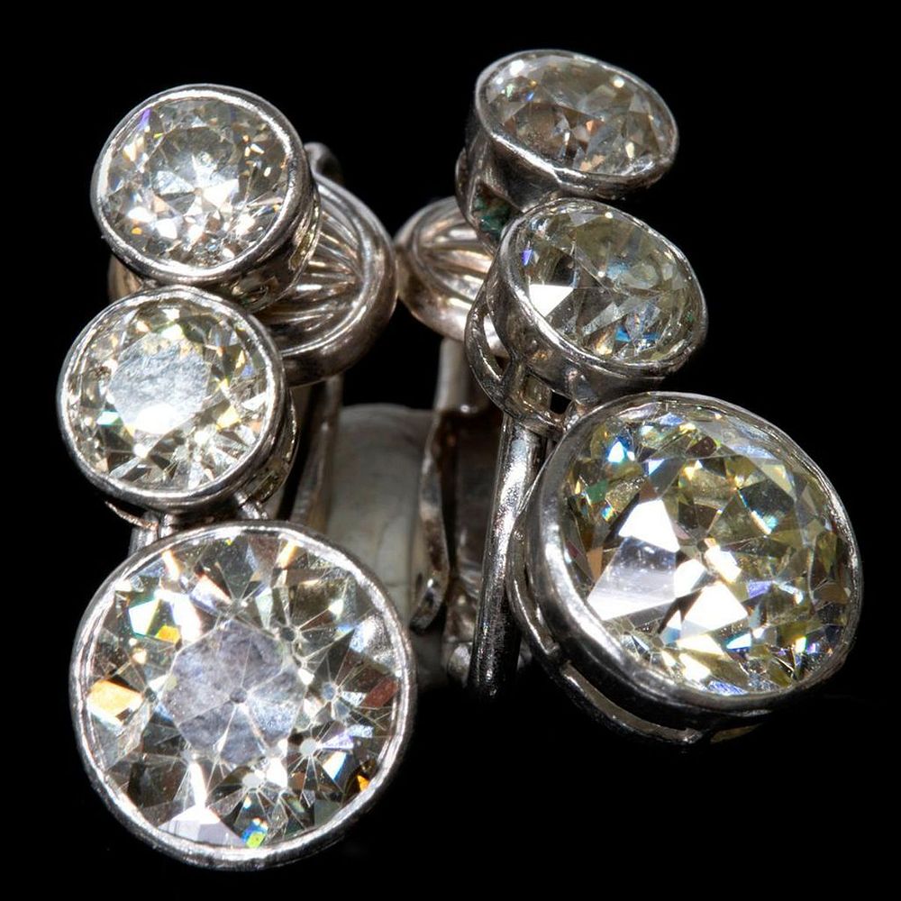 Appraisal: Vintage diamond and platinum clip earrings each designed with three