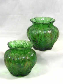 Appraisal: A pair of green iridescent glass vases circa cm high