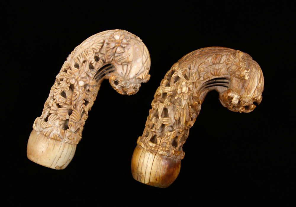 Appraisal: - Two th C Carved Umbrella Handles Two th century