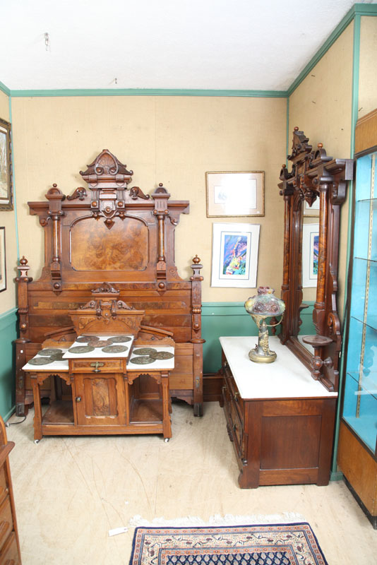 Appraisal: THREE PIECE VICTORIAN BEDROOM SET Heavily carved walnut with burlwood