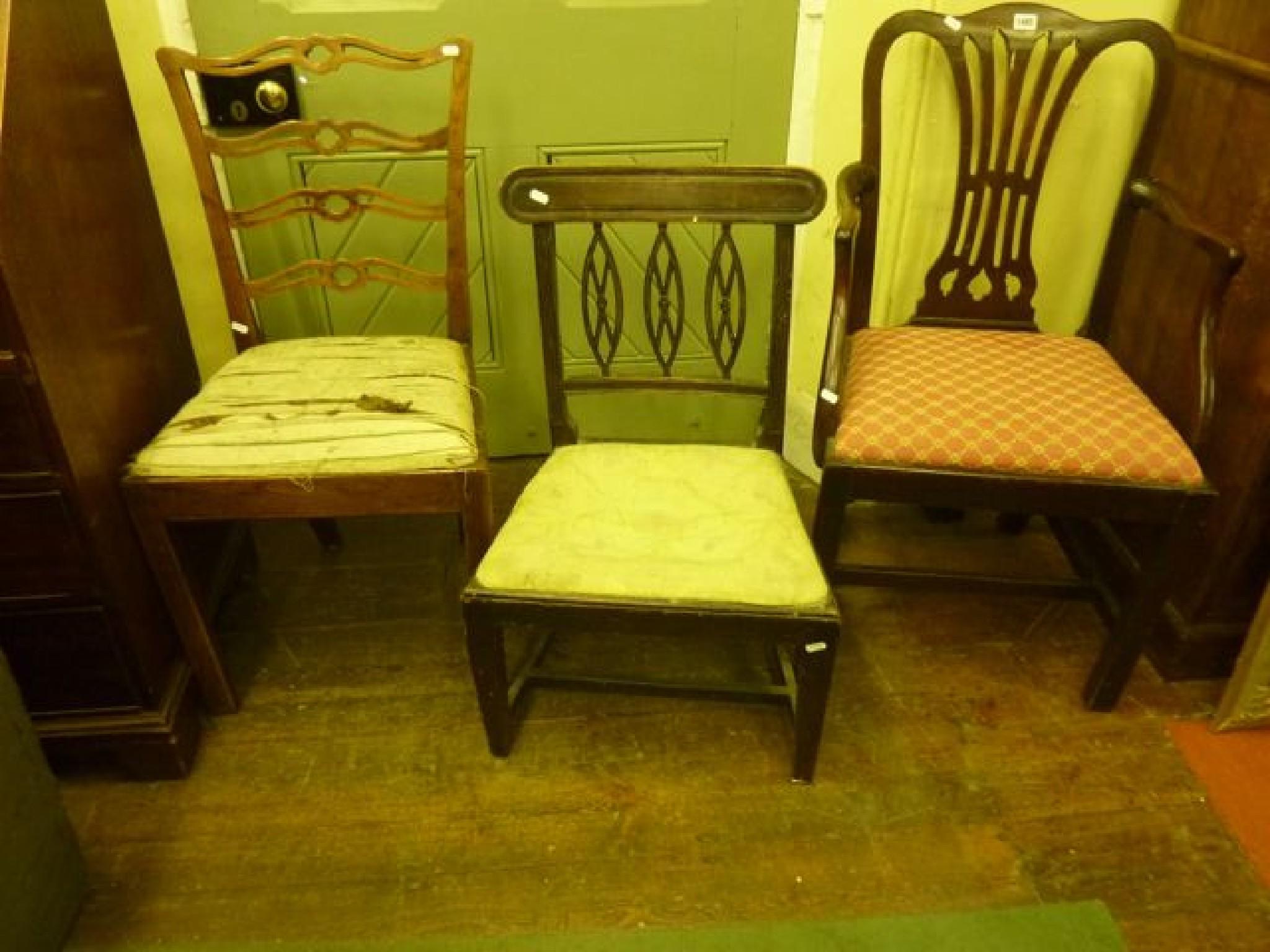 Appraisal: A Georgian mahogany elbow chair with pierced comb splat over