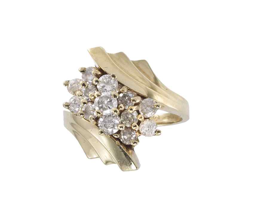 Appraisal: K GOLD AND DIAMOND RING K yellow gold ring contains