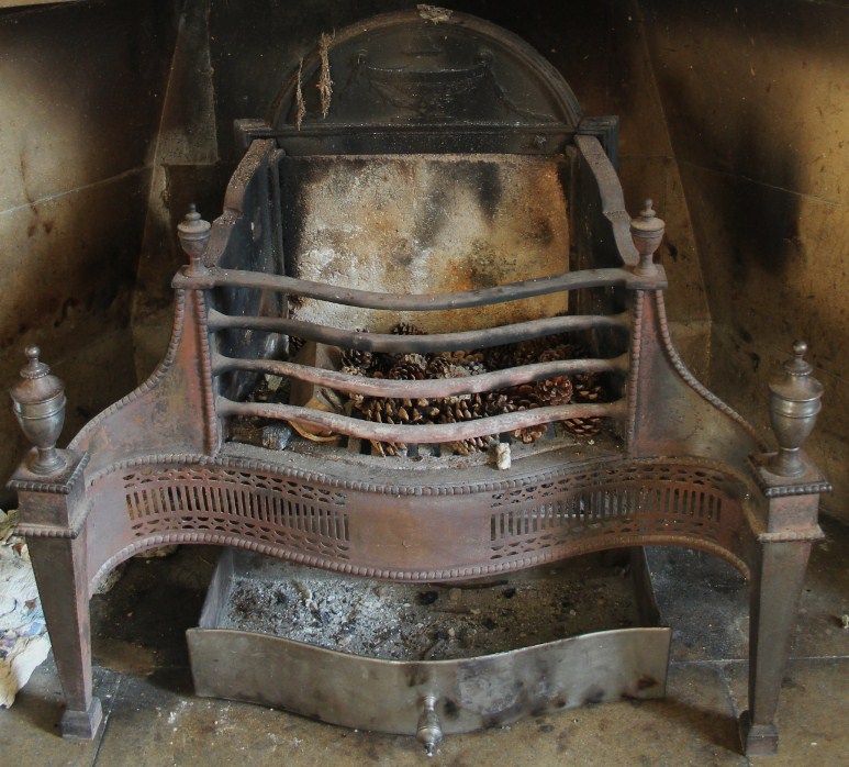 Appraisal: An Adam style fire grate