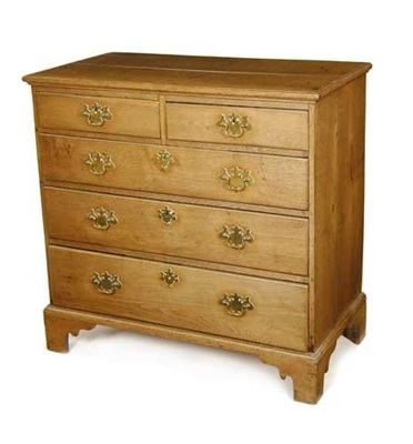 Appraisal: A late George III oak chest of two short and