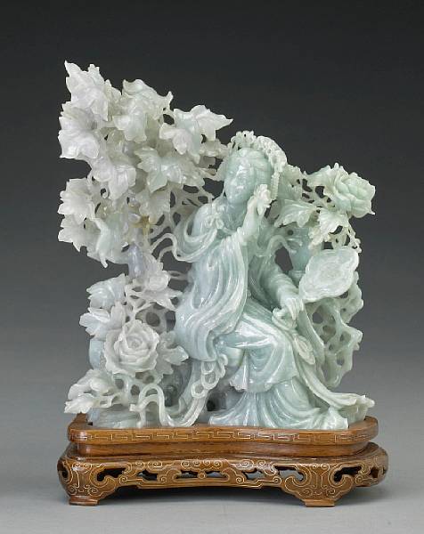 Appraisal: A pale green jadeite beauty th Century Holding a fan