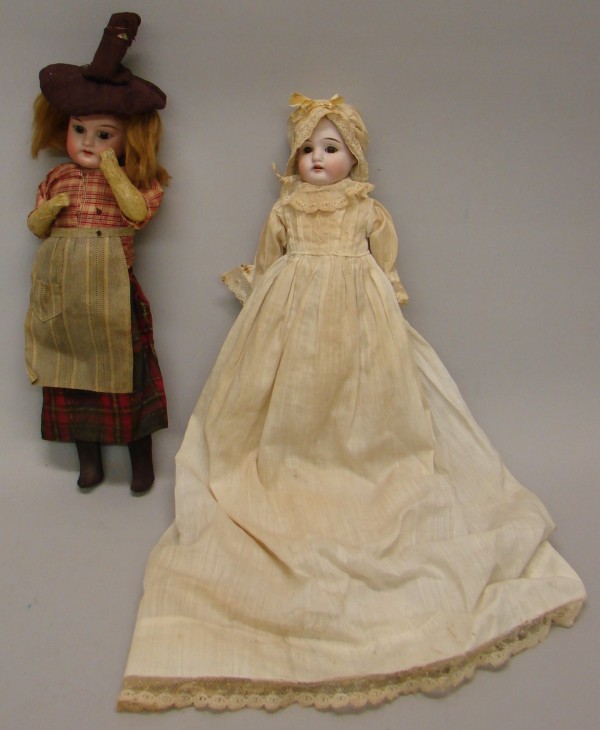 Appraisal: Pair of dolls Dep Brown sleep eyes open mouth plaster