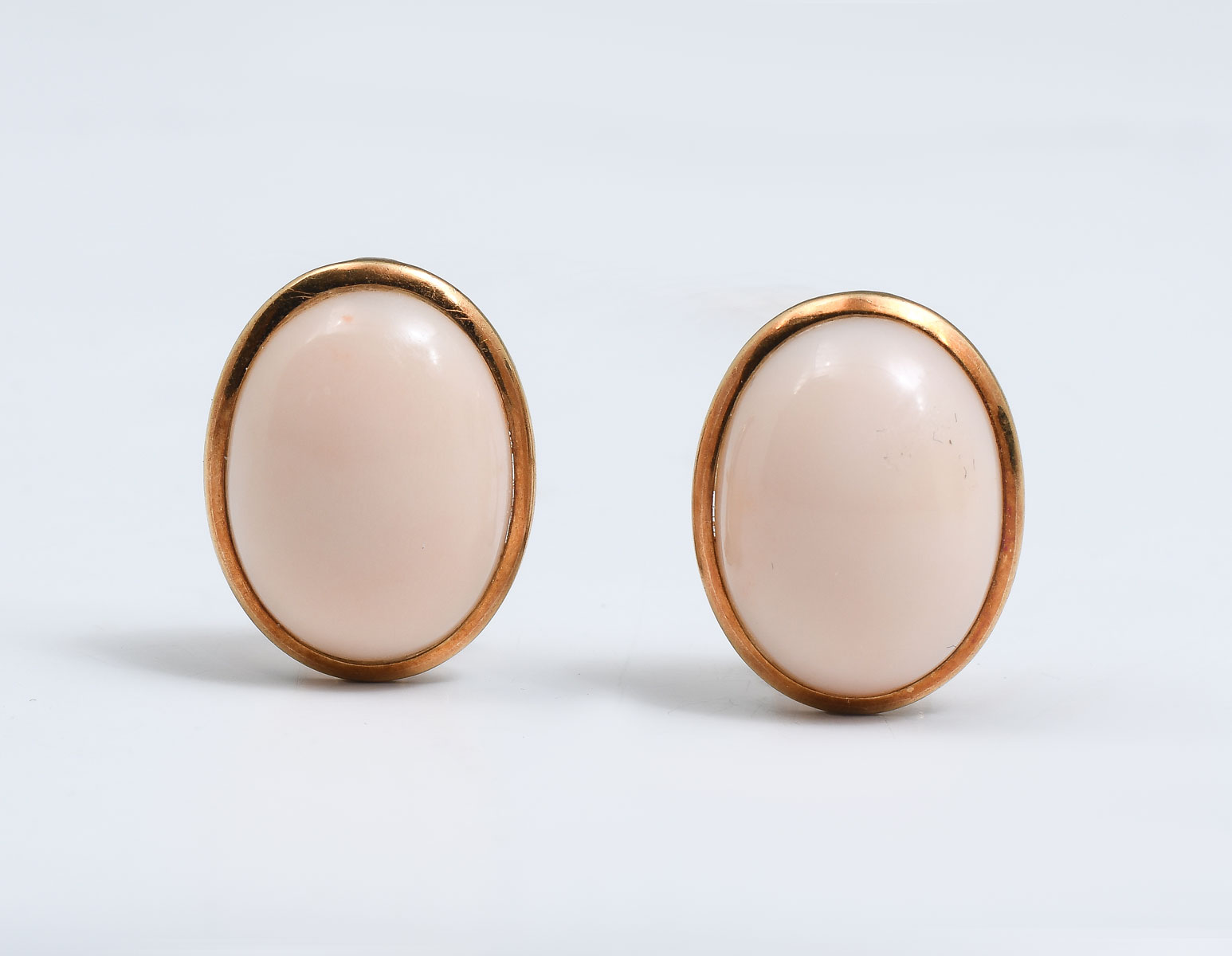 Appraisal: K PINK CORAL CABOCHON EARRINGS k yellow gold oval shape