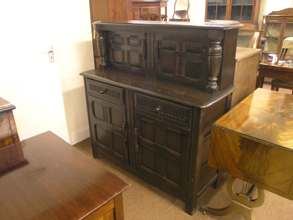 Appraisal: An Ercol-type dark elm court cupboard upper stage enclosed by