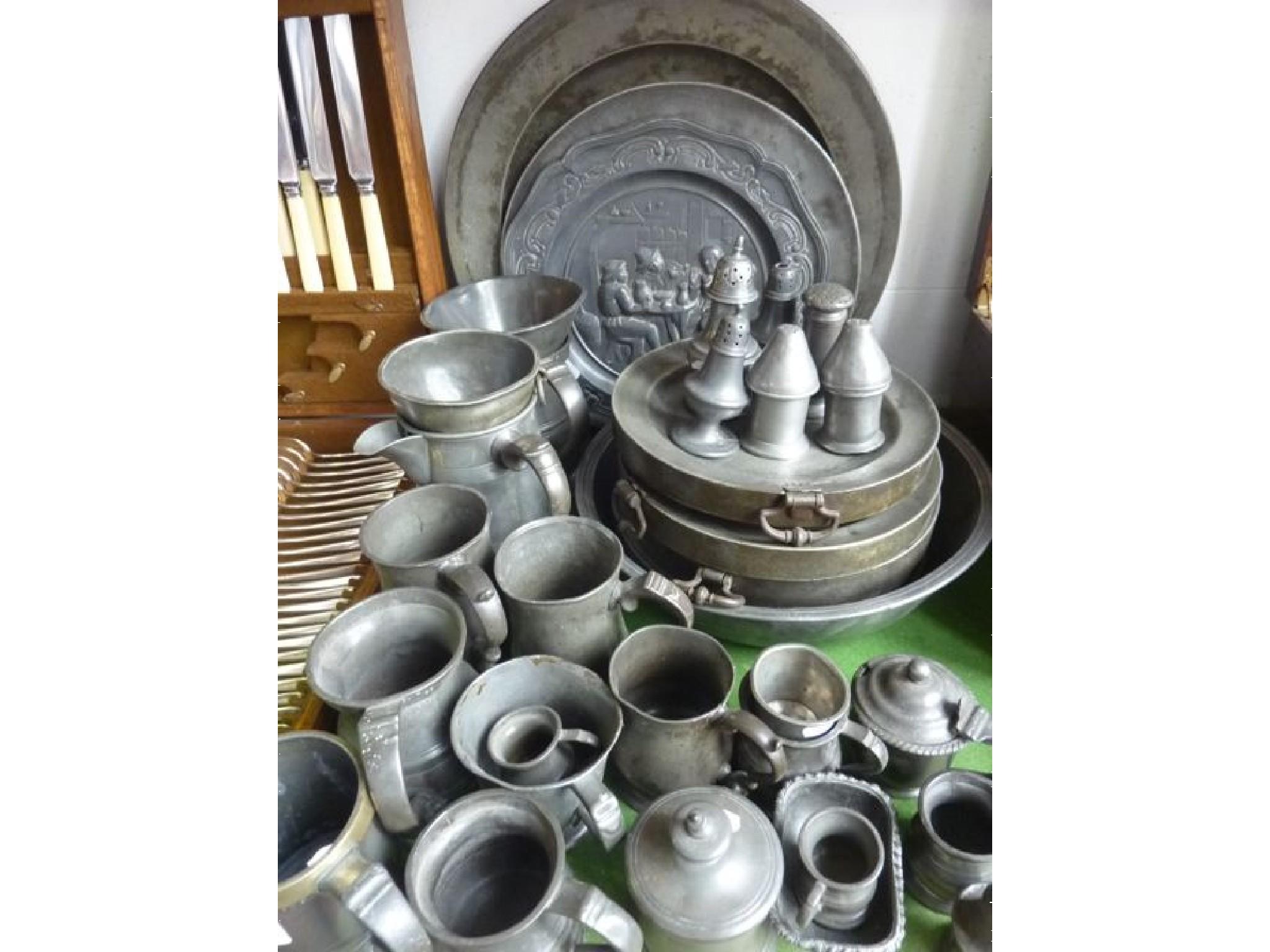 Appraisal: A quantity of pewter including mugs peppers gills funnels plates