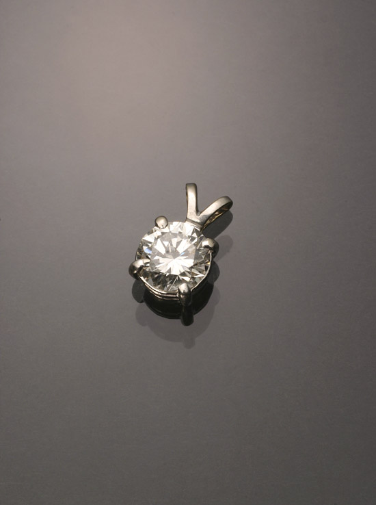 Appraisal: Tested -Karat White-Gold Solitaire Diamond Pendant The four-prong A-box mount