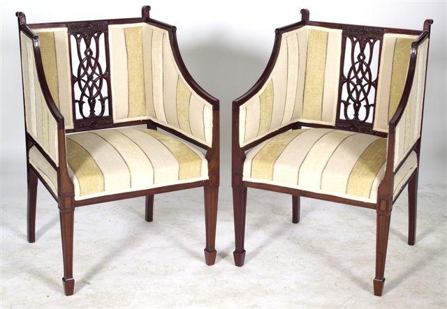 Appraisal: PAIR OF EDWARDIAN MAHOGANY ARMCHAIRS of bergere type each with