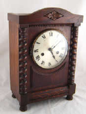 Appraisal: An oak striking mantel clock made by H A C