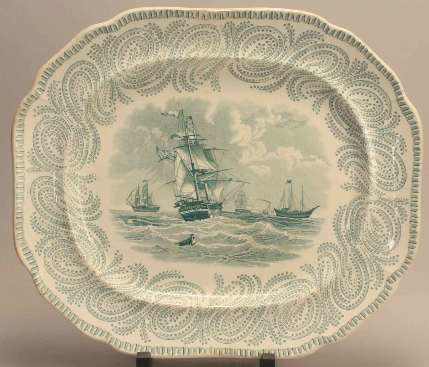 Appraisal: IRONSTONE PLATTERBy L G Alcock in Neptune'' pattern with green