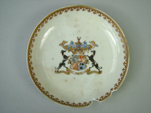 Appraisal: A Chinese porcelain armorial saucer with gilt decorated border and