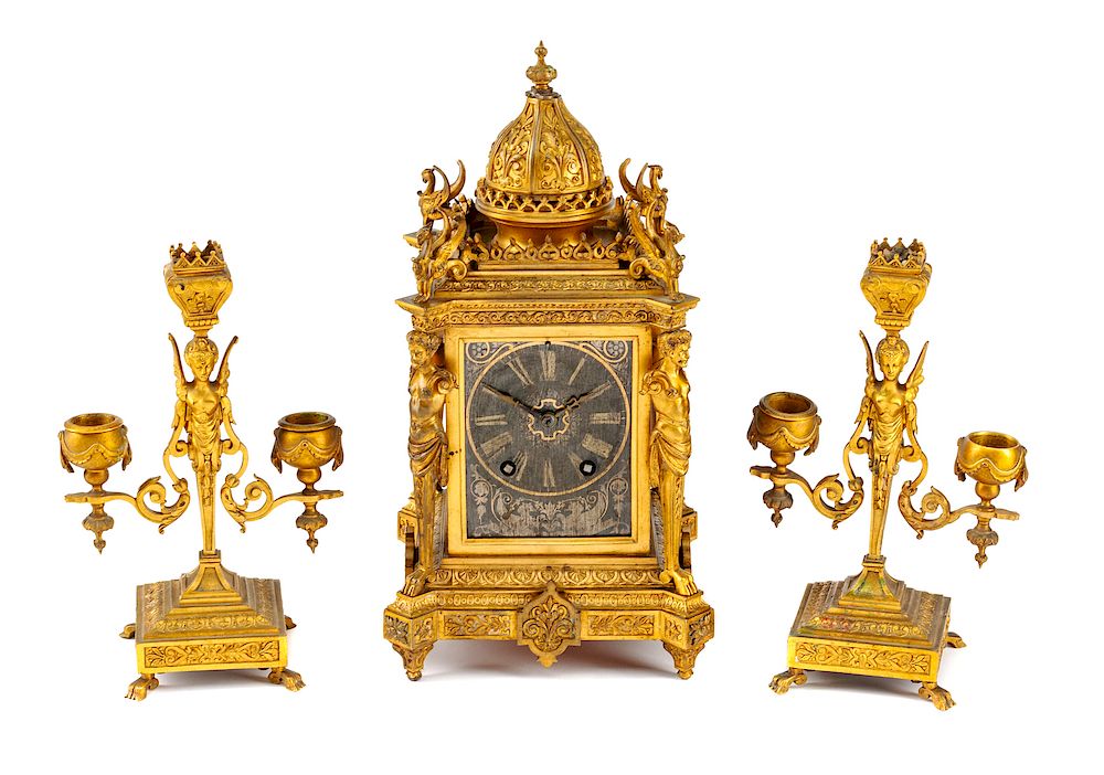 Appraisal: A Neoclassical Silvered and Gilt Bronze Three-Piece Clock Garniture A