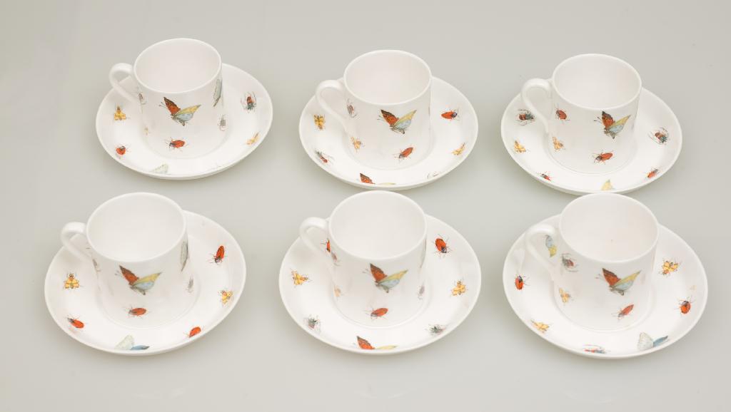 Appraisal: SET OF EIGHT COFFEE CANS AND SAUCERS printed and painted