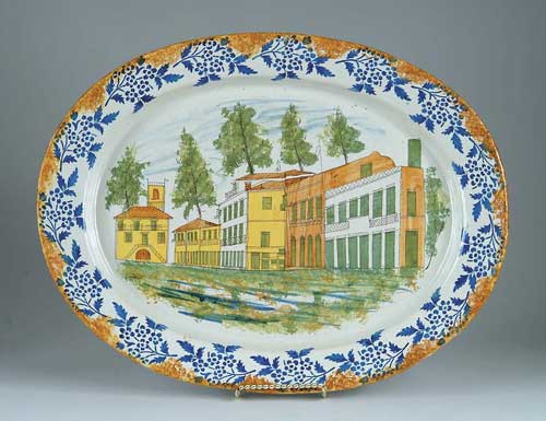 Appraisal: INTERESTING LARGE DECORATED POTTERY PLATTER Central scene shows church with