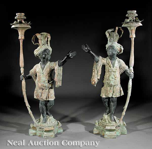 Appraisal: A Pair of Patinated Bronze Blackamoor Figural Torch res each