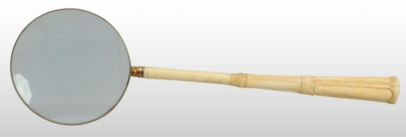 Appraisal: Long-Handled Ivory Magnifying Glass Description Ivory and glass are in