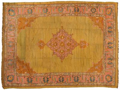 Appraisal: Oushak rug central medallion on gold amber field pale salmon