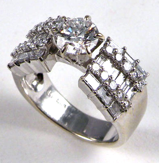 Appraisal: DIAMOND AND FOURTEEN KARAT WHITE GOLD RING WITH APPRAISAL The