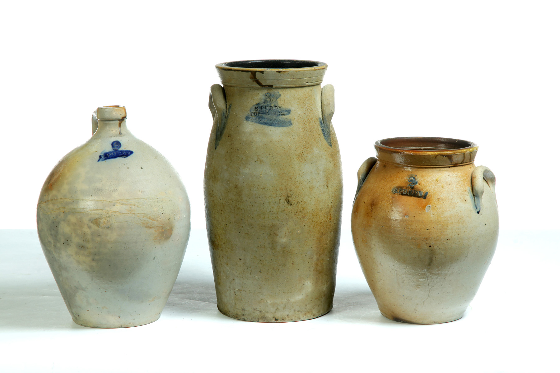 Appraisal: THREE PURDY STONEWARE PIECES WITH IMPRESSED MARKS AND COBALT DECORATION