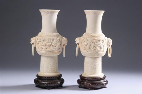 Appraisal: PAIR CHINESE IVORY VASES Dragon decoration - in high Two