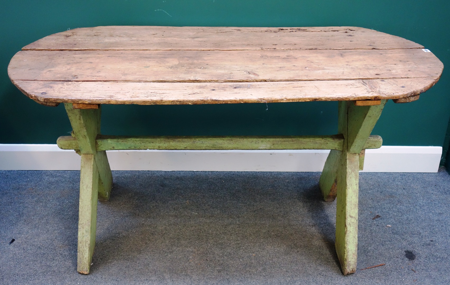 Appraisal: A th century pine tavern table on green painted 'X'