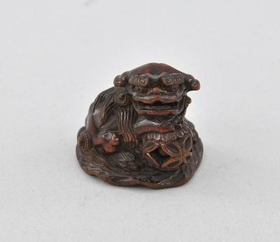 Appraisal: Wood Netsuke of Karashishi by Minkoku Carved wood with open