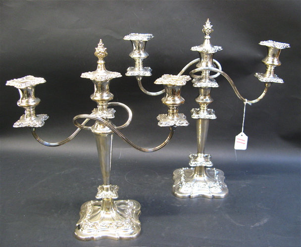 Appraisal: PAIR ENGLISH ORNATE SILVER PLATED CANDELABRA -light fitted with drip