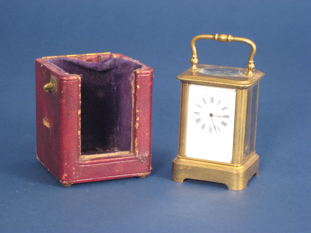 Appraisal: A small brass cased Carriage Clock with white enamel dial