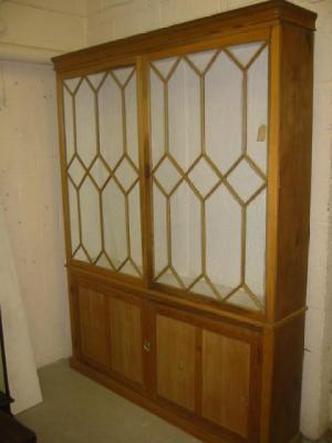 Appraisal: A PINE TWO STAGE CUPBOARD the upper part with moulded