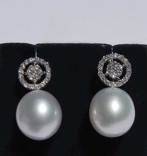 Appraisal: PEARL AND BRILLIANT-CUT DIAMOND STUD EARRINGS White gold Elegant stud