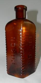 Appraisal: Poison bottle Poison- amber triangular form with rounded back corners