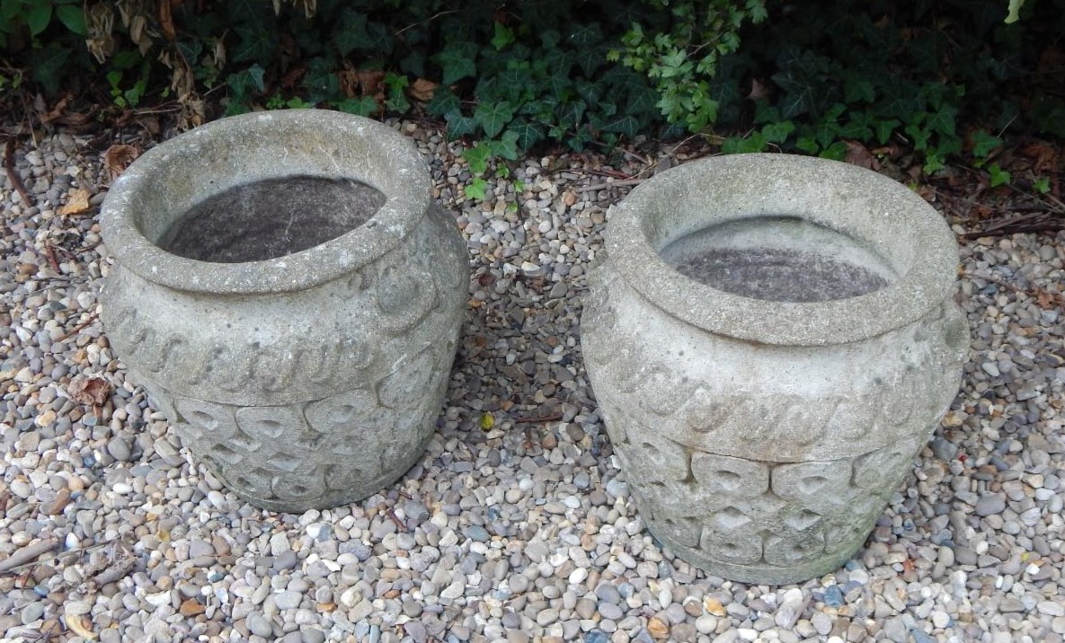 Appraisal: A pair of composition two handled garden urns by Cotswold