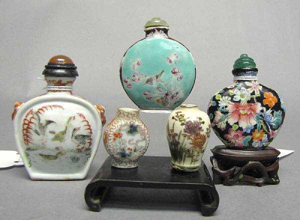 Appraisal: A group of three enameled porcelain snuff bottles Each of