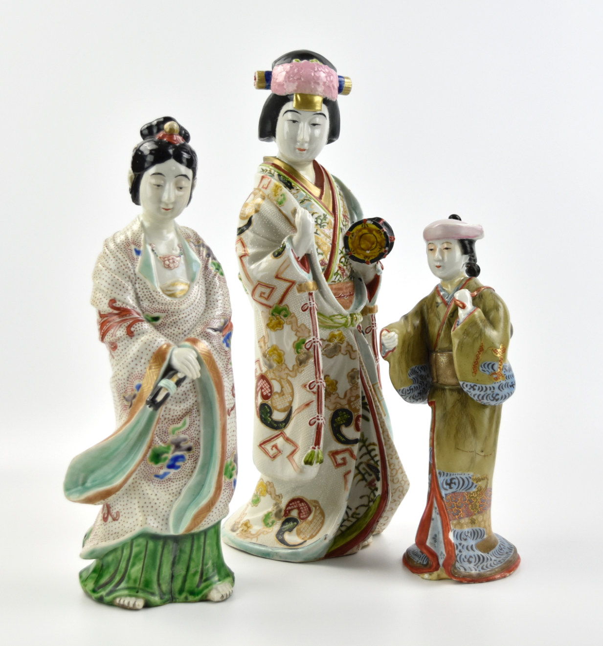 Appraisal: three Japanese female figures dressed in long traditional robes painted