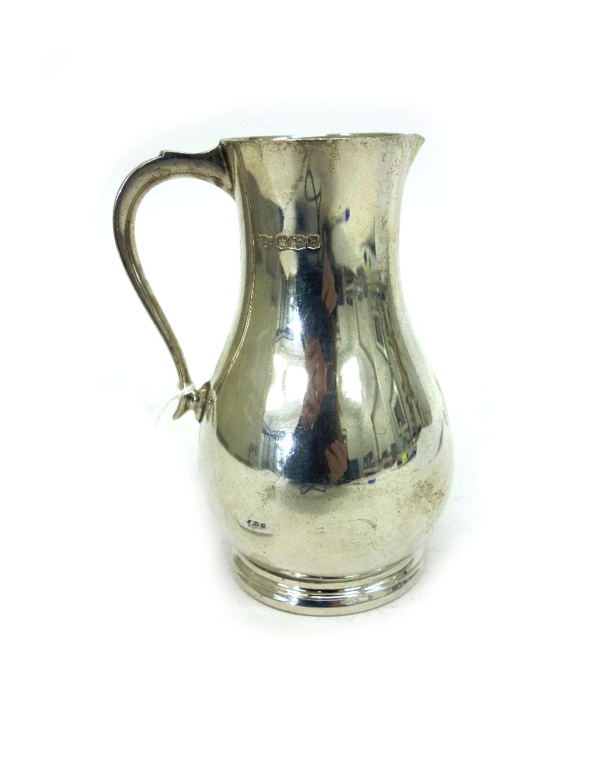 Appraisal: A George II style silver pear shape cream jug Mappin