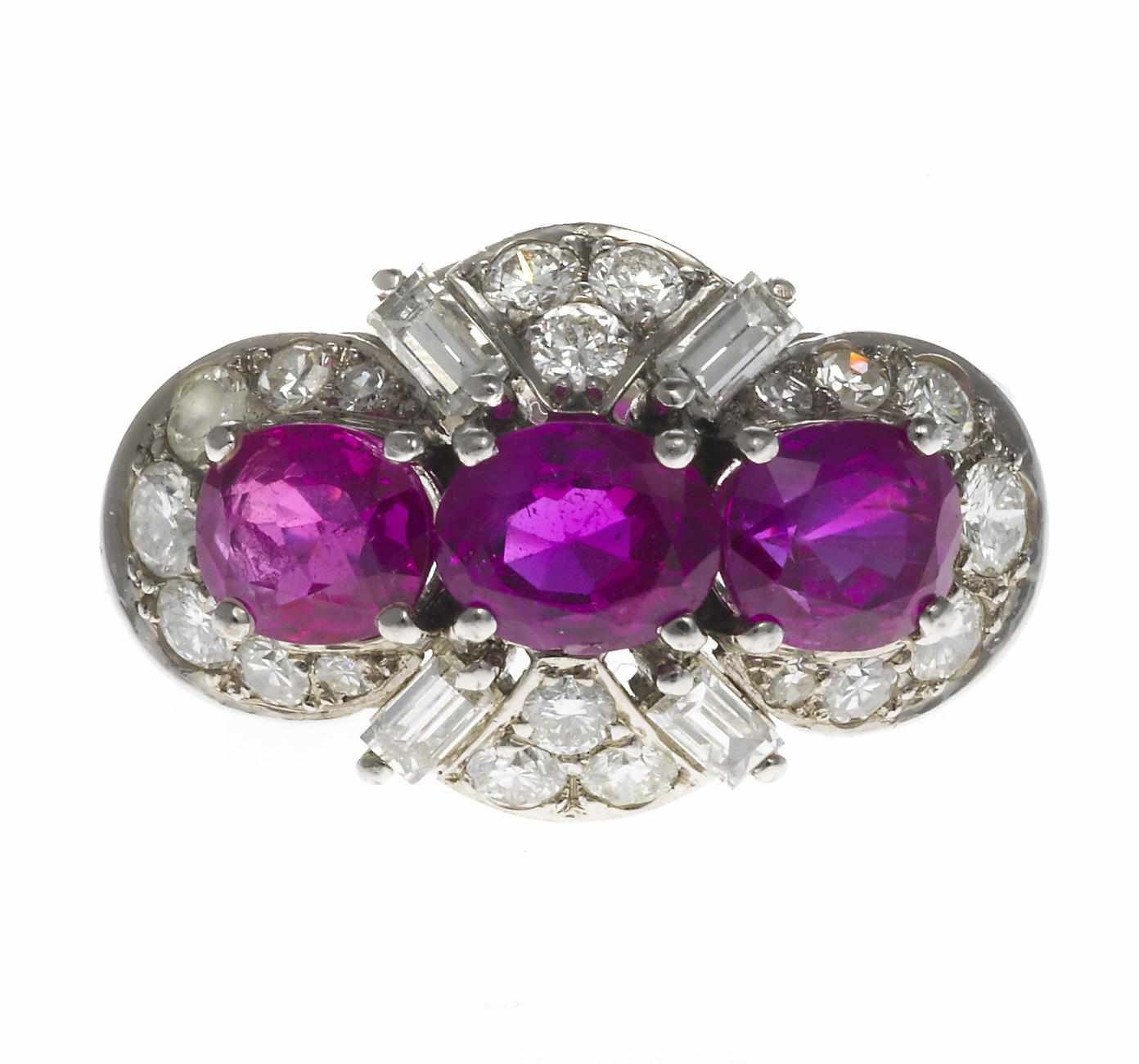 Appraisal: A pink sapphire and diamond three-stone ring Schilling signed Schilling