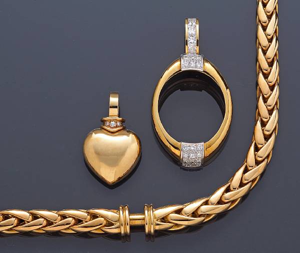 Appraisal: Two diamond oval and heart-shaped enhancers together with an eighteen