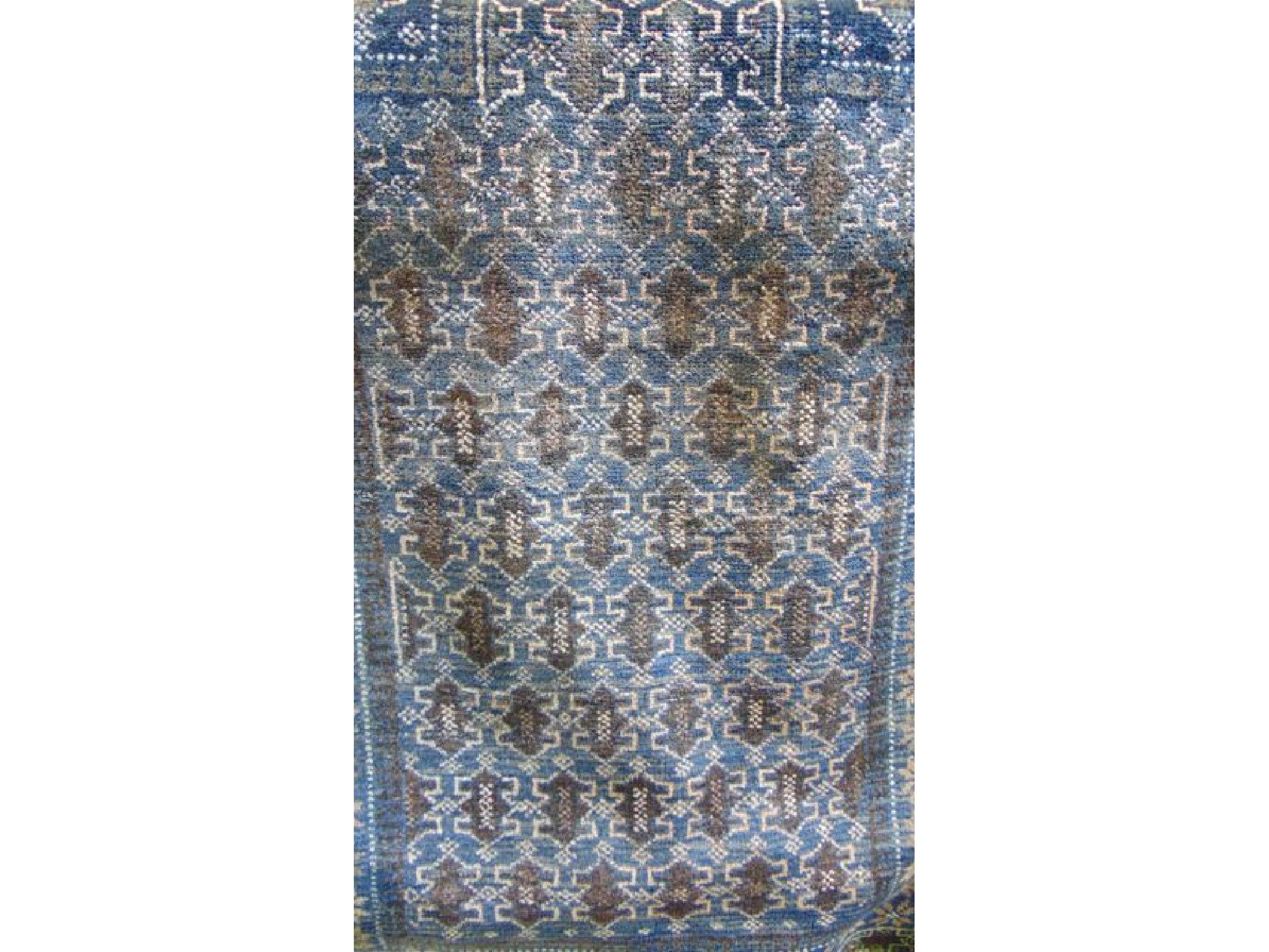 Appraisal: A small eastern wool rug with dark blue ground and