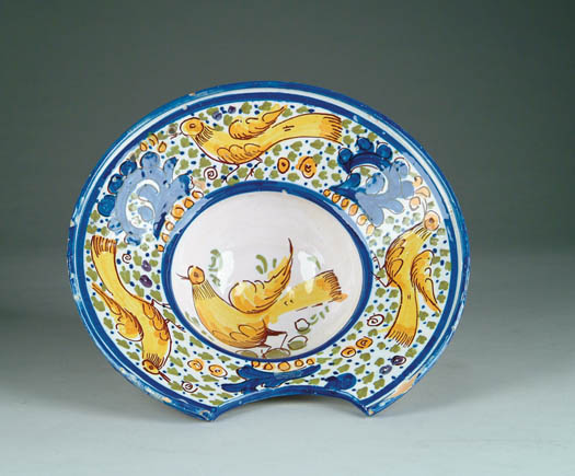 Appraisal: FAIENCE BARBER S BOWL Circular bowl with cutout decorated with