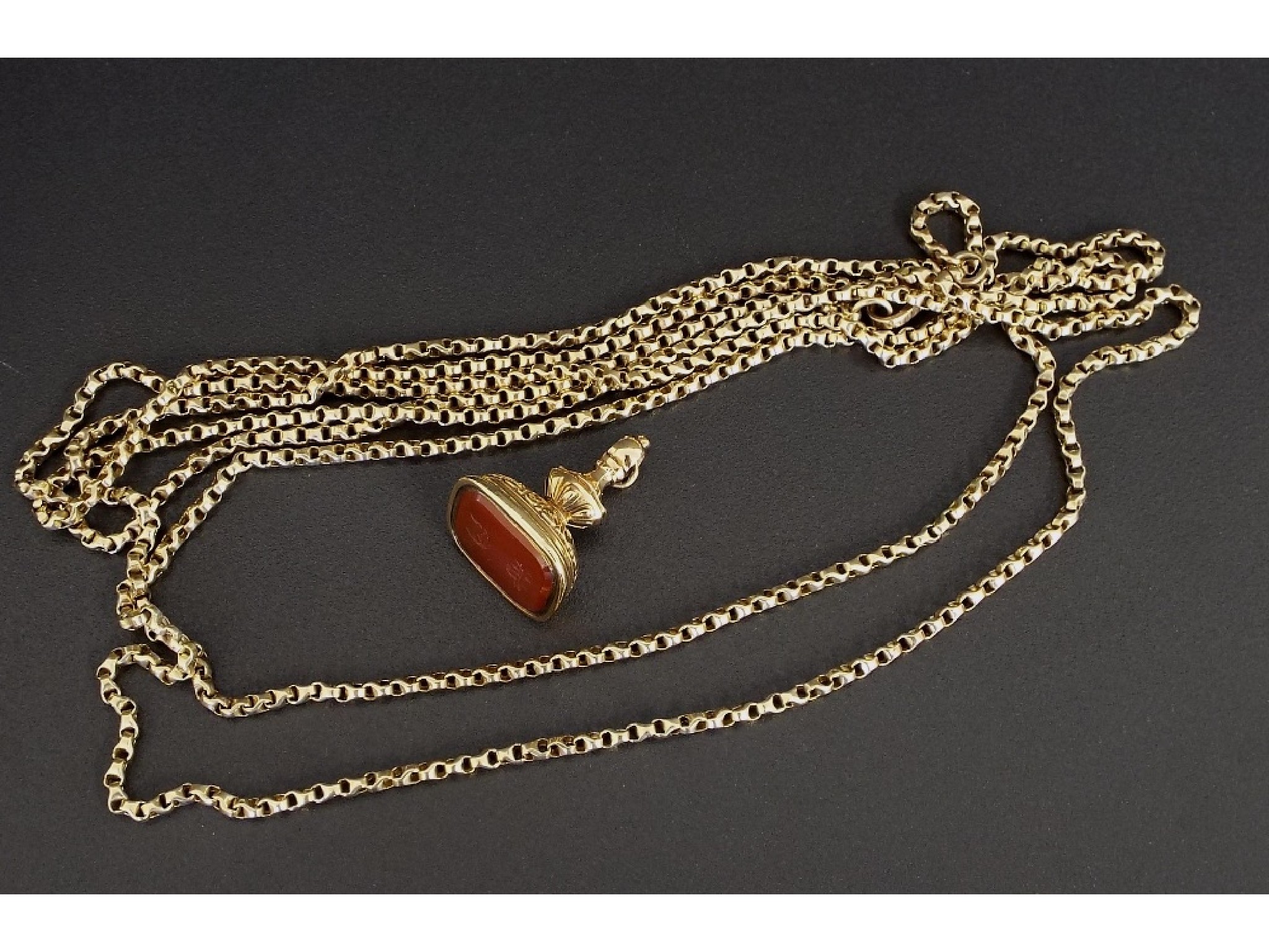 Appraisal: Gold mounted cornelian pendant fob gm together with a guard